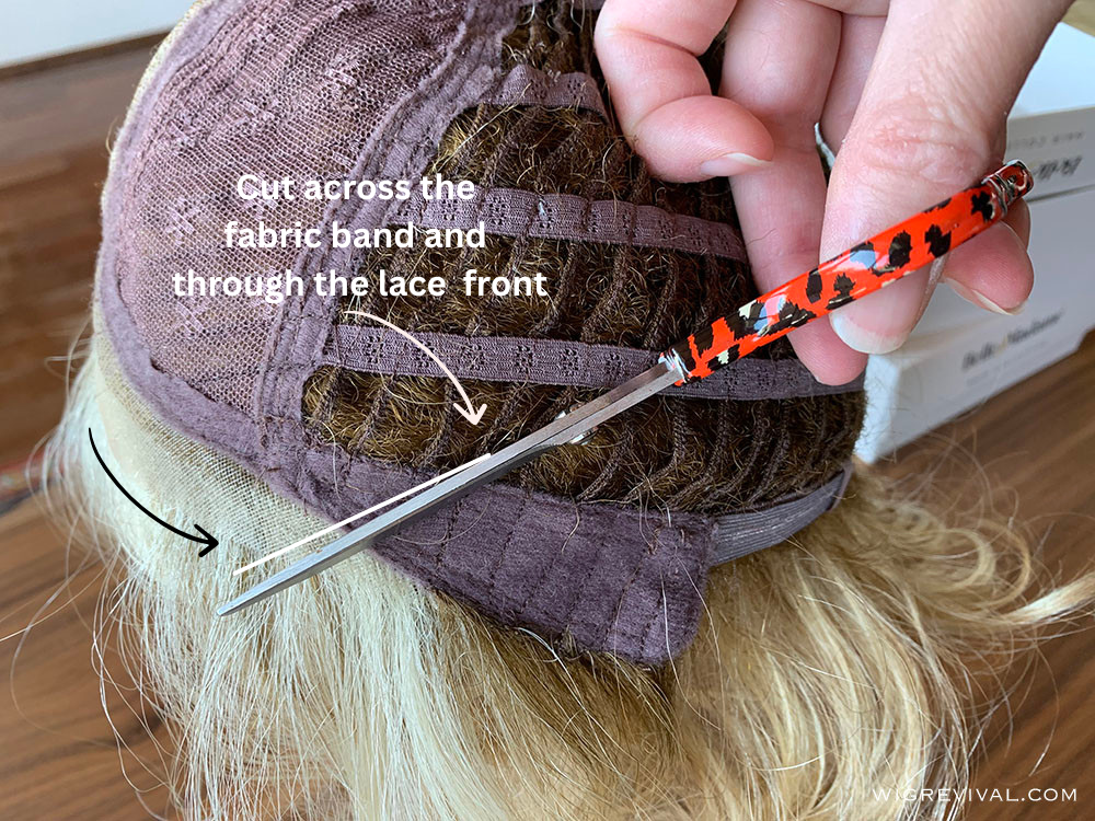 Cut across the fabric band on Wig