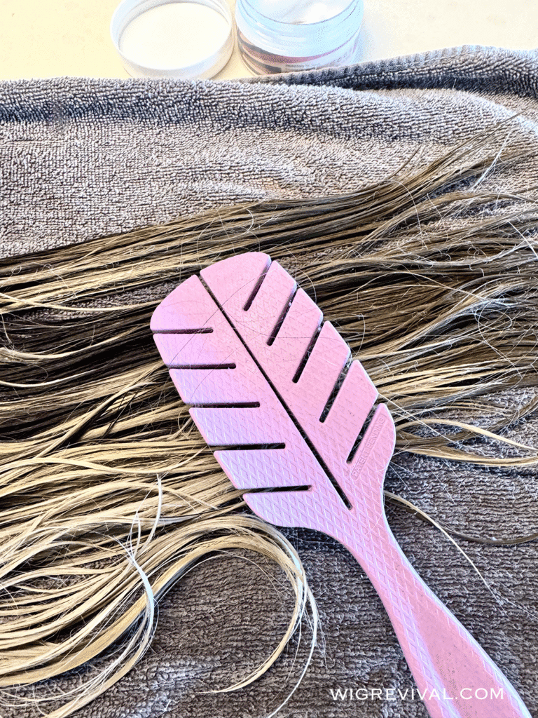 Gently comb out tangles in a wig